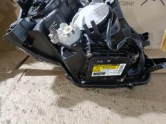 Фара 28-203 28-203 на Toyota Voxy ZRR70G Фото 3