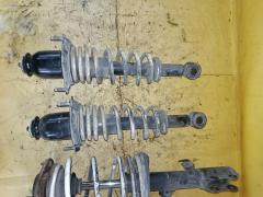 Стойка амортизатора на Toyota Corolla Fielder NZE141G 1NZ-FE Фото 2