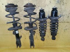 Стойка амортизатора на Toyota Corolla Fielder NZE144G 1NZ-FE