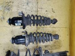 Стойка амортизатора на Toyota Corolla Fielder NZE144G 1NZ-FE Фото 2