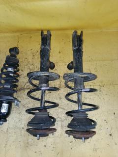 Стойка амортизатора на Toyota Corolla Fielder NZE144G 1NZ-FE Фото 3