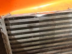 Радиатор интеркулера на Nissan Note E12 HR12DDR Фото 3