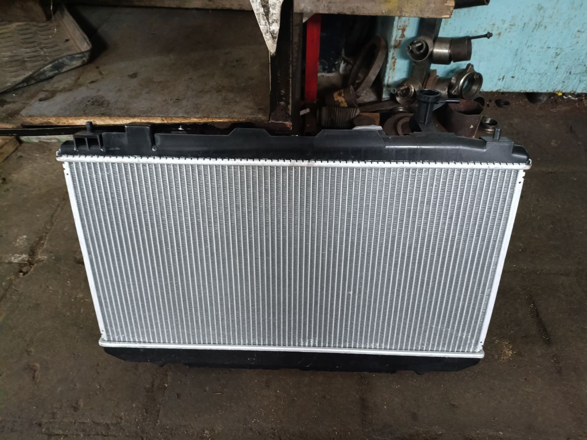 Радиатор ДВС TADASHI TD-036-6737, 16400-28130, 16400-28140, 16400-28180, 16400-28182, 16400-28190, 164002813087, 1640028131, 1640028160, 1640028170, 1640028171, 1640028480, 64639А, FX-036-6737, FX-036-6737A, TD-036-6737A на Toyota Rav4 ACA21W 1AZ-FSE Фото 4