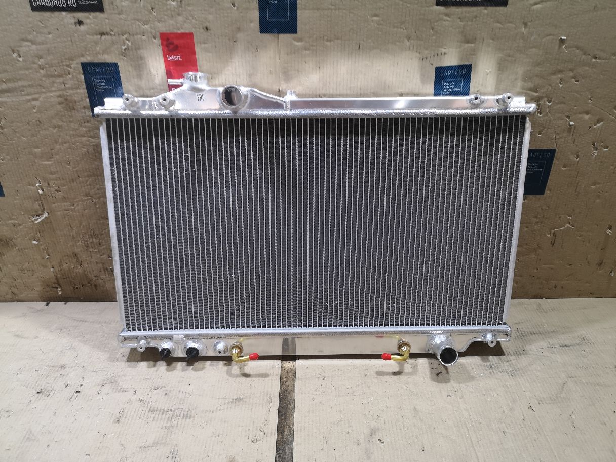 Радиатор ДВС TADASHI TD-036-0975A, 104383, 130087, 1461-0340, 16400-46310, 16400-46310-N1, 16400-46310-R1, 16400-46320, 16400-46320-N1, 16400-46320-R1, 1640046310, 1640046320, 210137N, 210138N, 31-3302, 31-3303, 53002346, 53002347, 60532346, 60532347, 734174, 734175, 812347R, 816108-2, 816108-4, ADT398146, ADT39884, CU1855, D1773, D1774, DBP177003, DBP177004, FX-036-0975, FX-036-0975A, FX-036-7048, FX-036-7048A, PA010413, PA010414, T156A84, T550-60, T550-61, T550-62, TD-036-0975, TD-036-7048, TD-036-7048A, TO2346, TO2347 на Toyota Supra JZA80 2JZ-GTE Фото 2