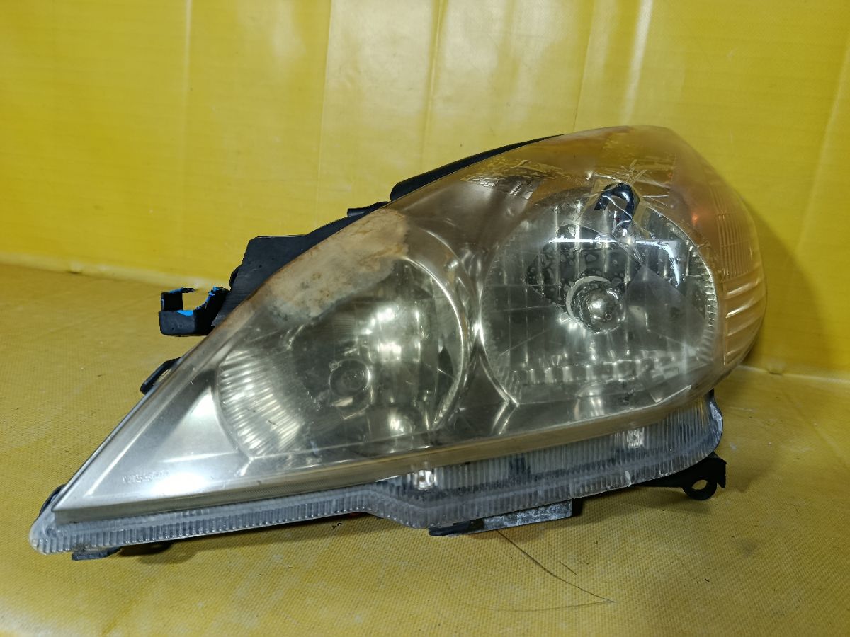 Фара 1699 1699 на Nissan Wingroad WFY11 Фото 1