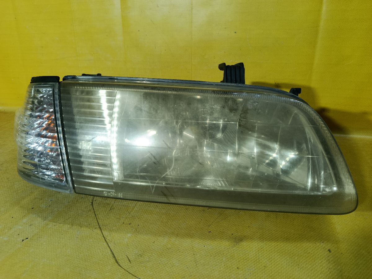 Фара 1602 1602 на Nissan Sunny FB15 Фото 1