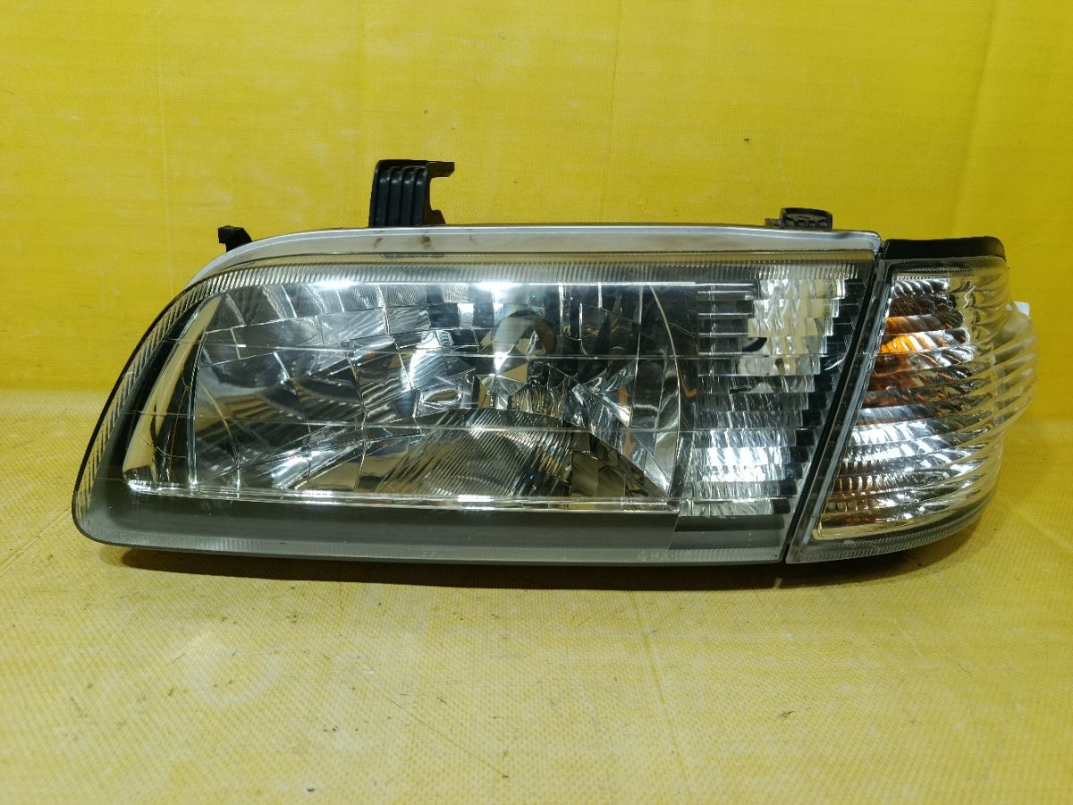 Фара 1602 1602 на Nissan Sunny FB15 Фото 1
