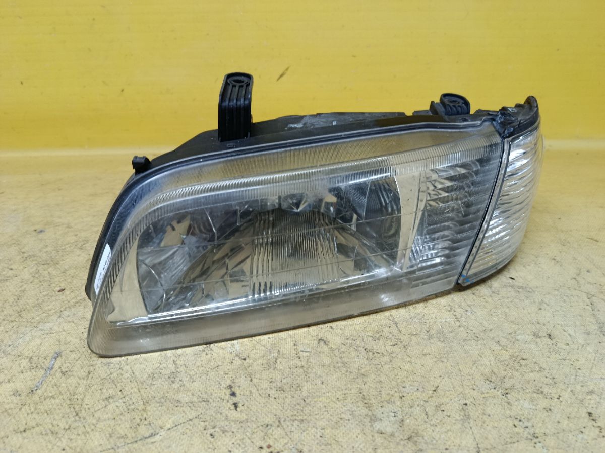 Фара 1602 1602 на Nissan Sunny FB15 Фото 1