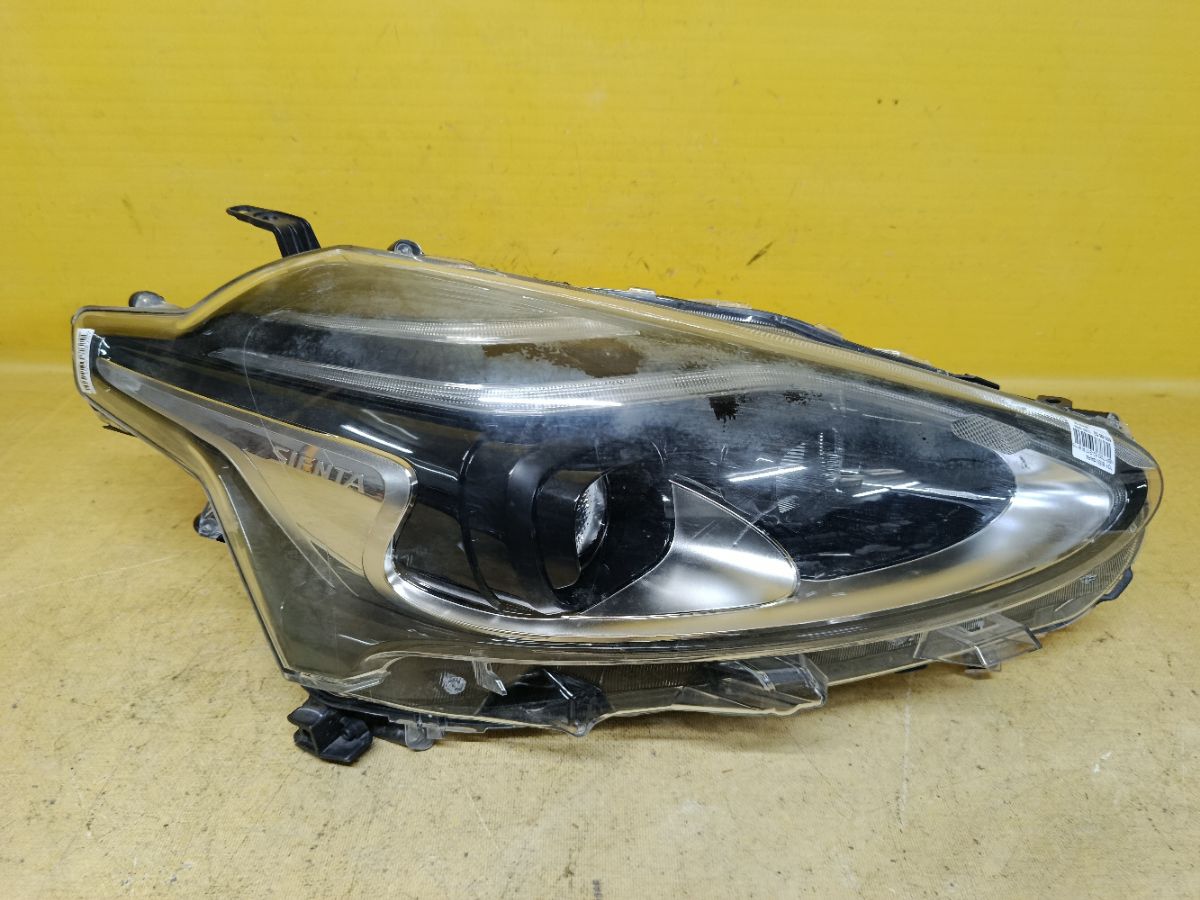 Фара 52-317 52-317,81150-52N00 на Toyota Sienta NSP170G Фото 1
