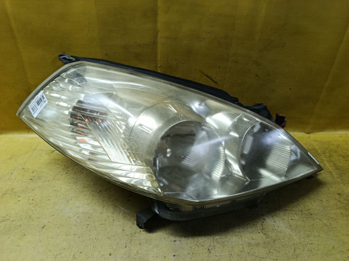 Фара 1698 1698 на Nissan Wingroad WFY11 Фото 1