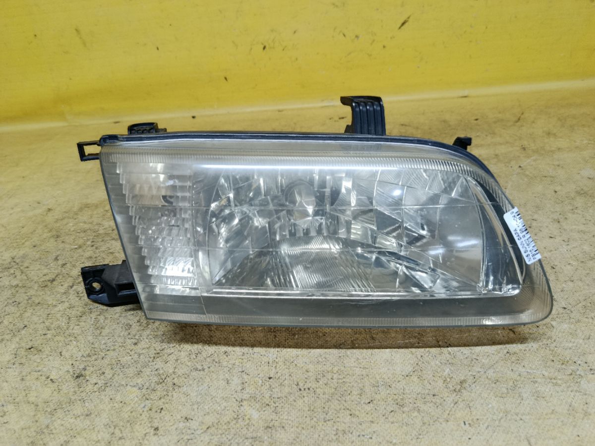 Фара 1602 1602 на Nissan Sunny FB15 Фото 1
