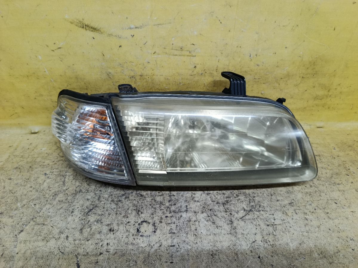 Фара 1602 1602 на Nissan Sunny FB15 Фото 1