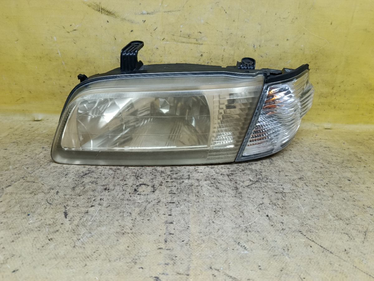 Фара 1602 1602 на Nissan Sunny FB15 Фото 1