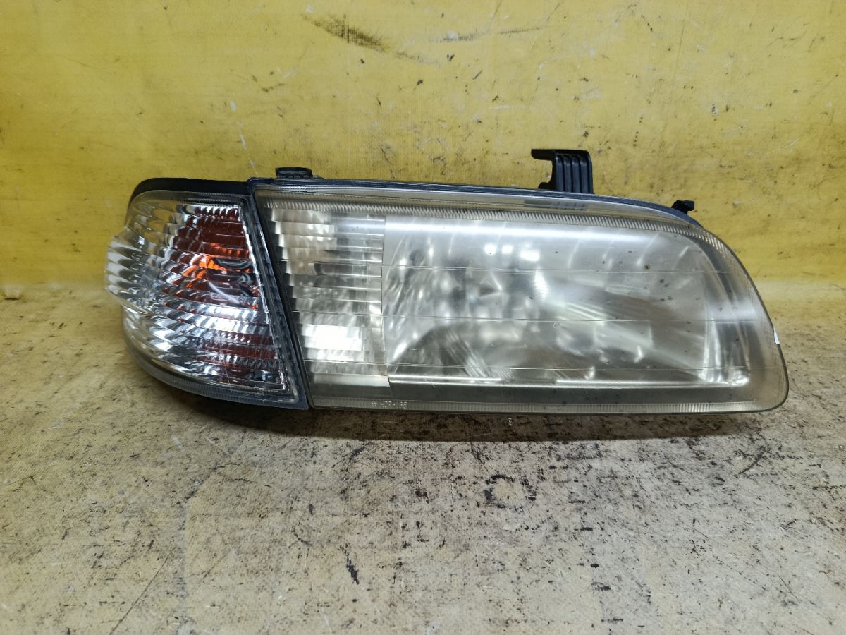 Фара 1602 1602 на Nissan Sunny FB15 Фото 1