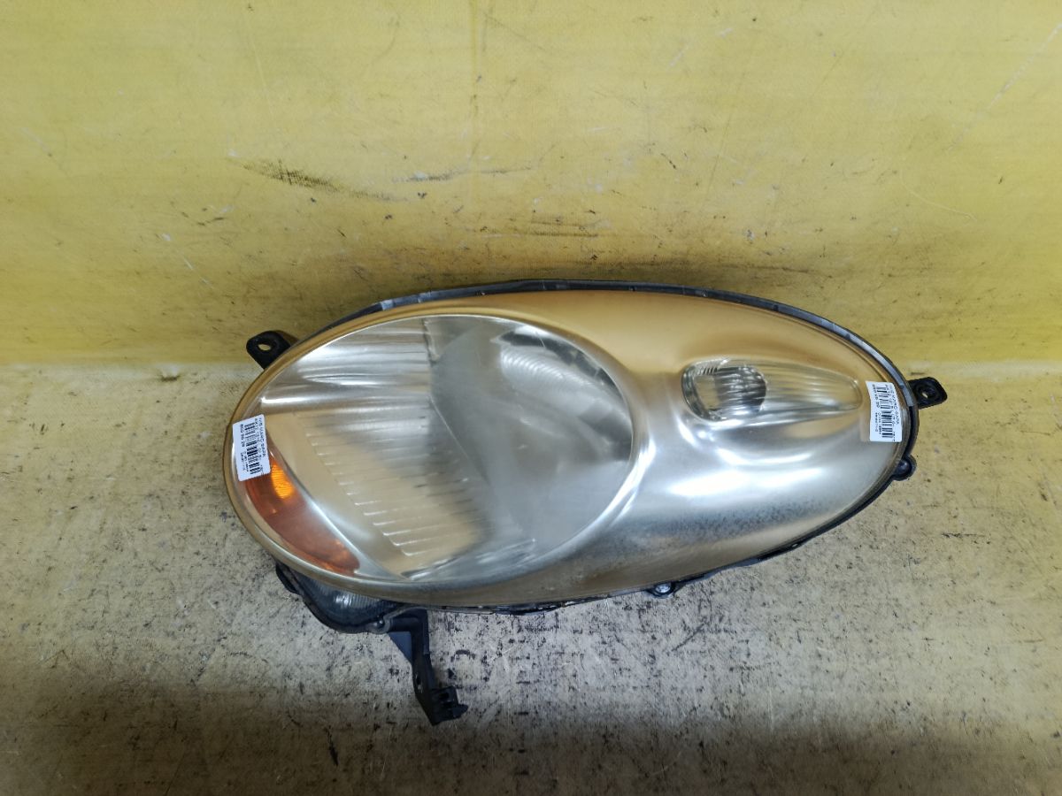 Фара 1816 1816 на Nissan March AK12 Фото 1