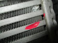 Радиатор интеркулера Y0130002 на Nissan Note E12 HR12DDR Фото 4
