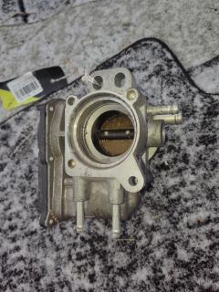 Дроссельная заслонка 22030-23010 на Toyota Ractis SCP100 2SZ-FE Фото 7