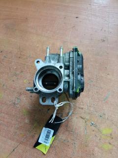 Дроссельная заслонка 22030-23010 на Toyota Ractis SCP100 2SZ-FE Фото 9