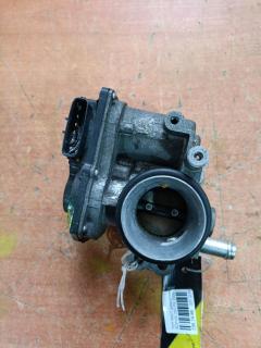 Дроссельная заслонка 22030-23010 на Toyota Ractis SCP100 2SZ-FE Фото 11