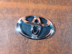 Эмблема на Toyota Yaris NCP91L 75311-52140, Переднее расположение