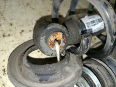 Амортизатор 48530-52D50 на Toyota Ractis NCP120 Фото 8