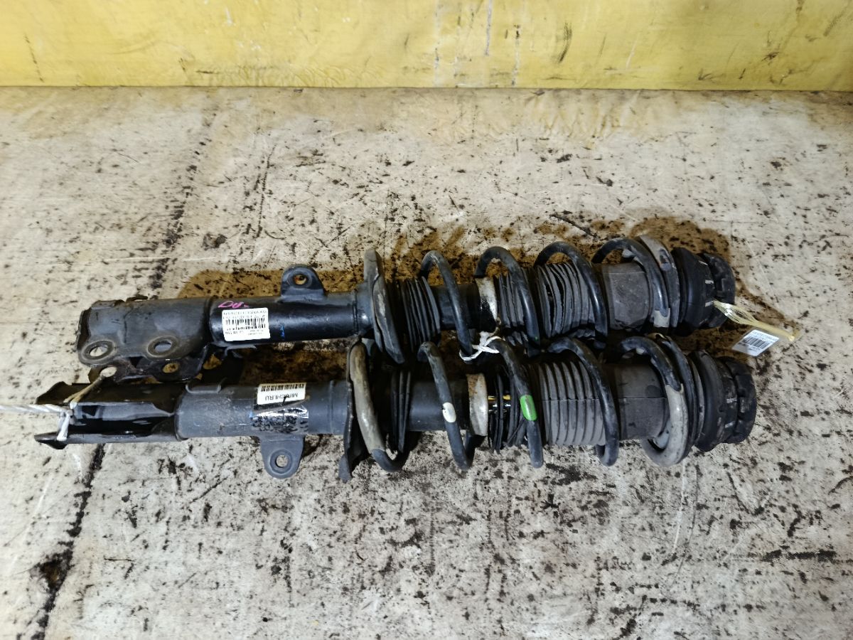 Стойка амортизатора на Nissan Note E12 HR12DDR Фото 2