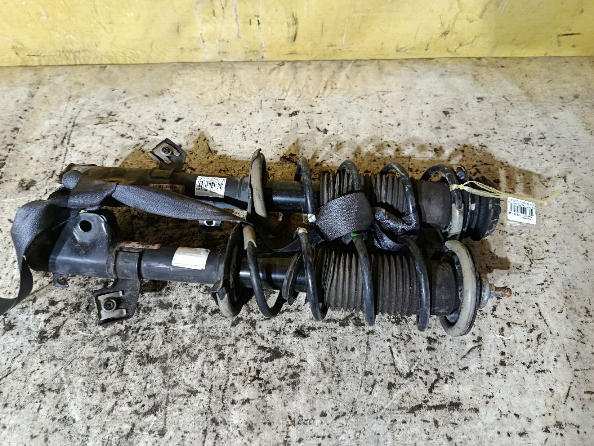 Стойка амортизатора на Nissan Note E12 HR12DDR Фото 2