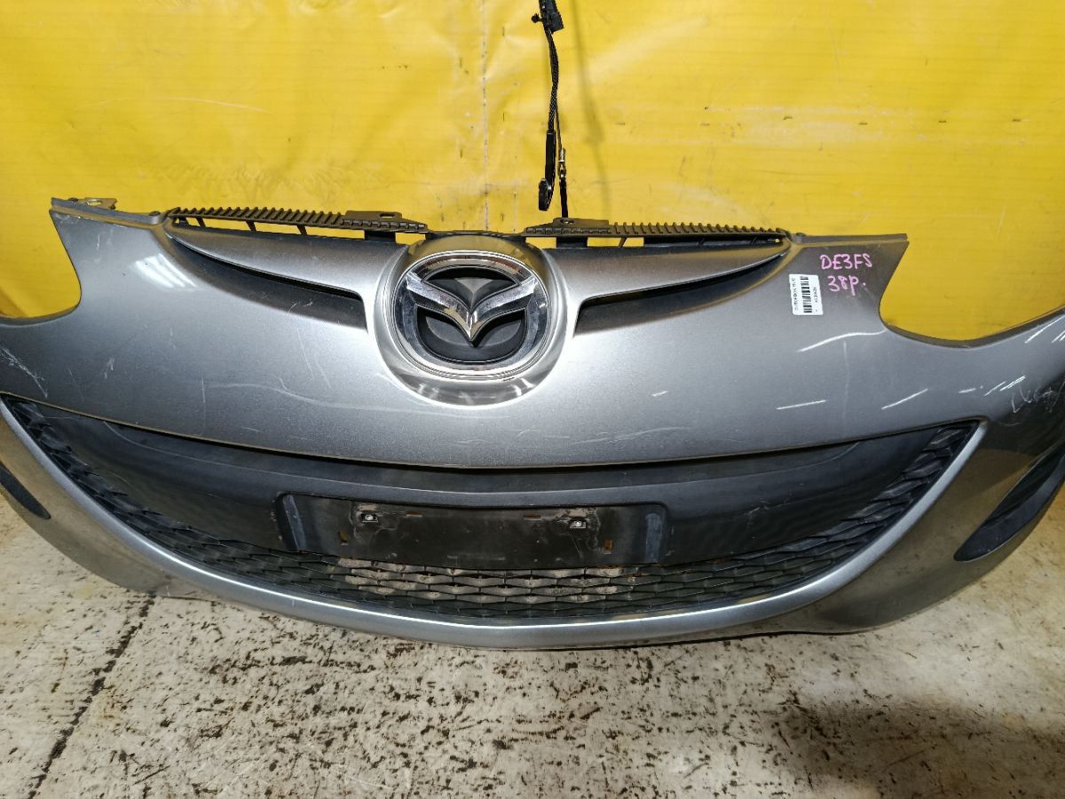 Бампер DR61-500312, 038D65150031C8N, 25301967, 2741570, 3421901, 5605050, 931104, D65150031B8H, D65150031BAA, D65150031C8N, D65150031CAA, D65150031CBB, MZ04105BA, MZ04105BAV, MZ04105BB, MZ51100000000, STMZ520000 на Mazda Demio DE3FS Фото 3