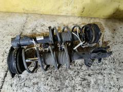 Стойка амортизатора на Nissan Tiida C11 HR15DE Фото 3