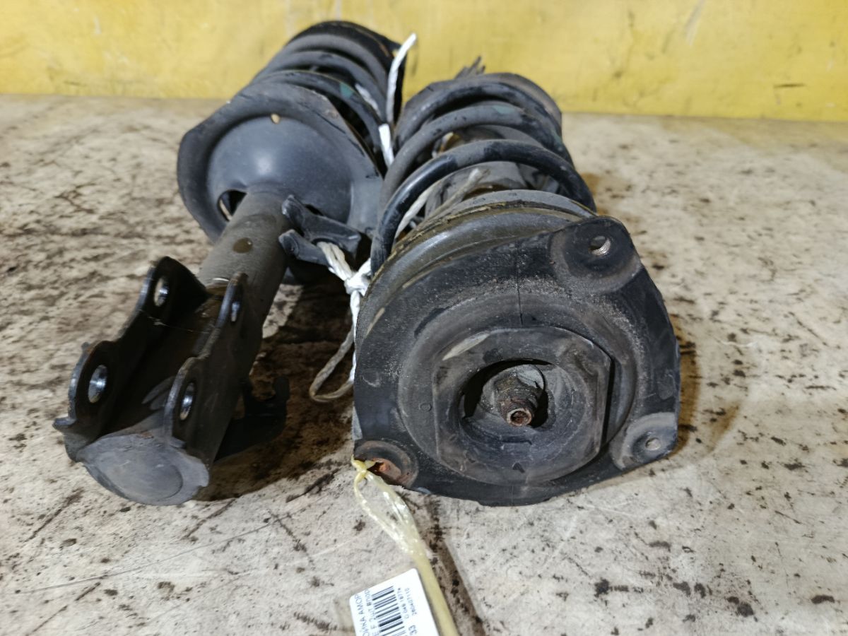 Стойка амортизатора на Nissan Tiida C11 HR15DE Фото 5