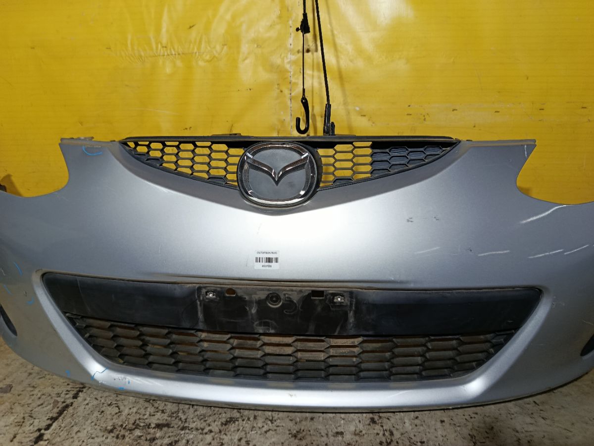 Бампер D651-50031, 038D65150031C8N, 25301967, 2741570, 3421901, 5605050, 931104, D65150031B8H, D65150031BAA, D65150031C8N, D65150031CAA, D65150031CBB, MZ04105BA, MZ04105BAV, MZ04105BB, MZ51100000000, STMZ520000 на Mazda Demio DE3FS Фото 3