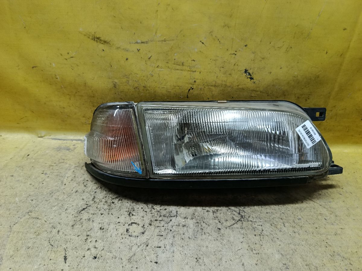 Фара 1544 1544, на Nissan Wingroad WFY10 Фото 1