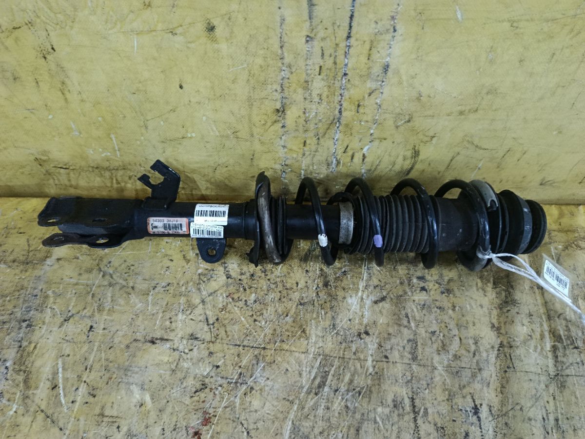 Стойка амортизатора 54303-3VJ1A на Nissan Note E12 HR12DDR Фото 1