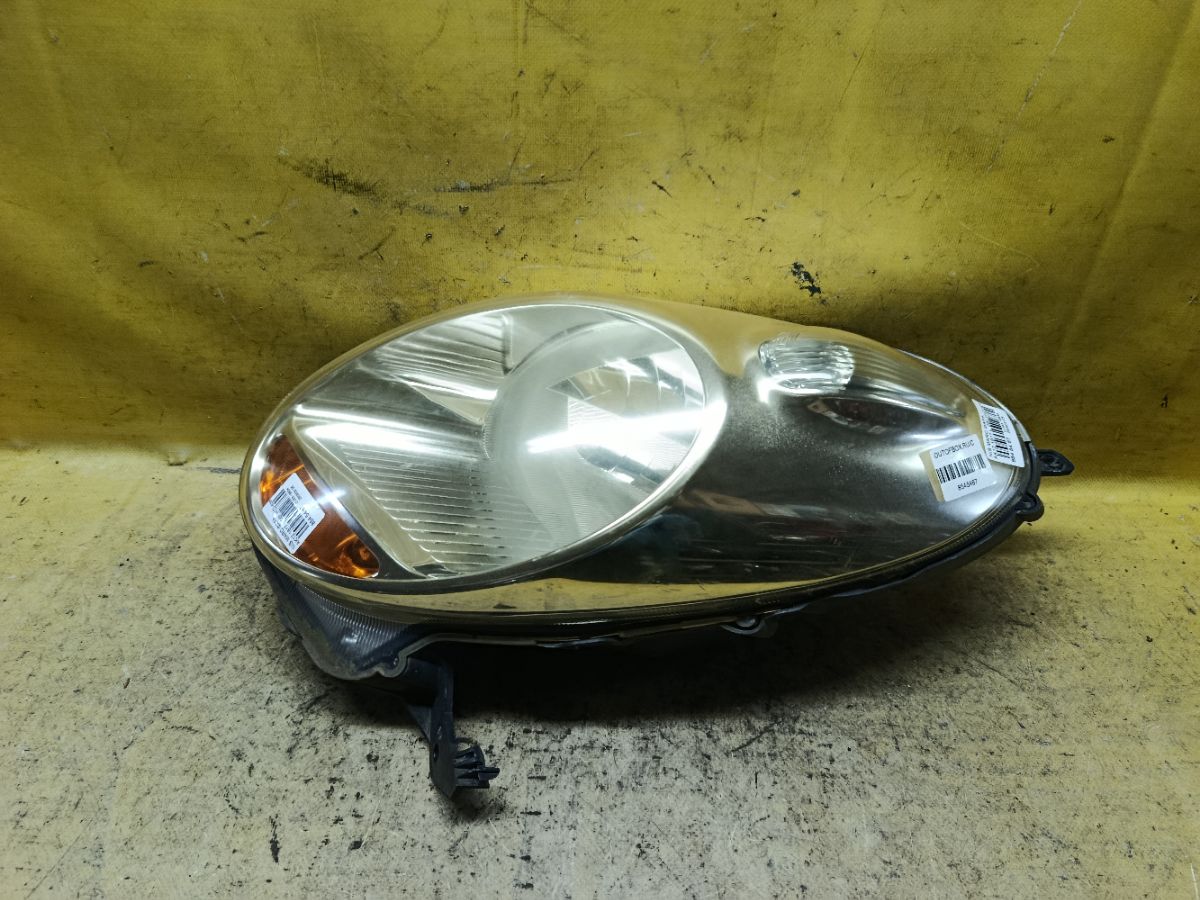 Фара 1817 1817, на Nissan March AK12 Фото 1