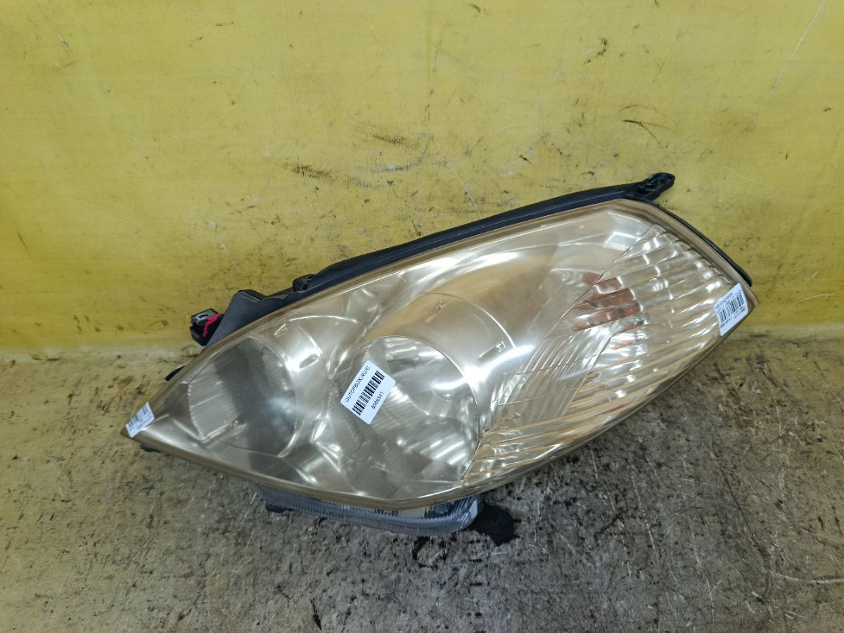Фара 1698 1698, на Nissan Wingroad WFY11 Фото 1