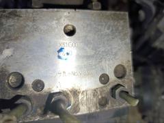 Блок ABS на Nissan Elgrand ATE50 ZD30DDTI Фото 11