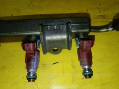 Форсунка инжекторная 16600-AX000 на Nissan March BK12 CR14DE Фото 4