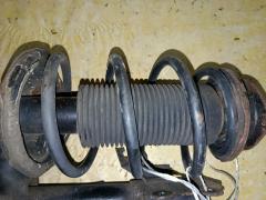 Стойка амортизатора на Nissan Wingroad WFY11 QG15DE Фото 3