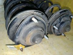 Стойка амортизатора MR594341, MR594342 на Mitsubishi Grandis NA4W 4G69 Фото 2