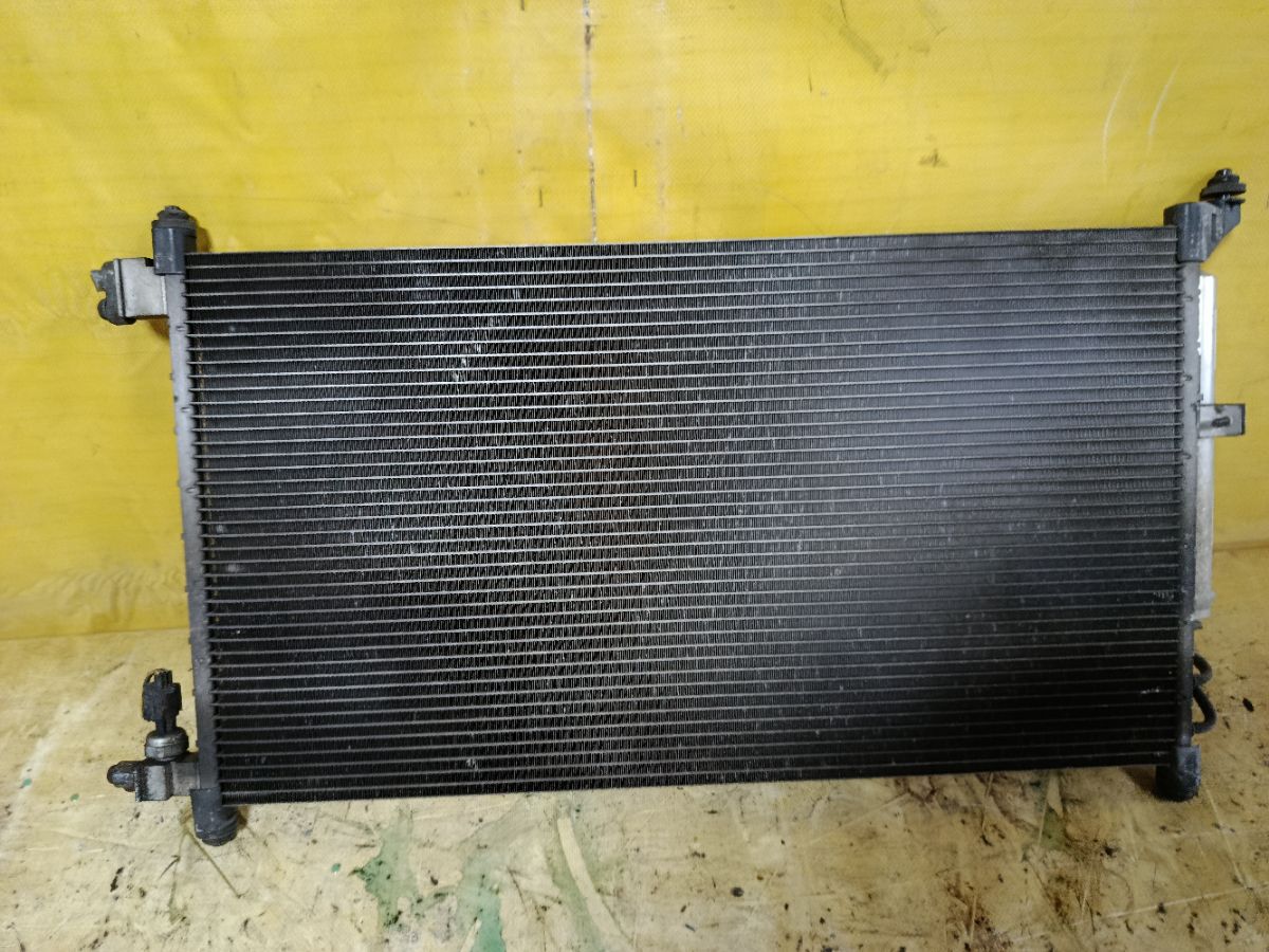 Радиатор кондиционера на Nissan March AK12 CR12DE Фото 2