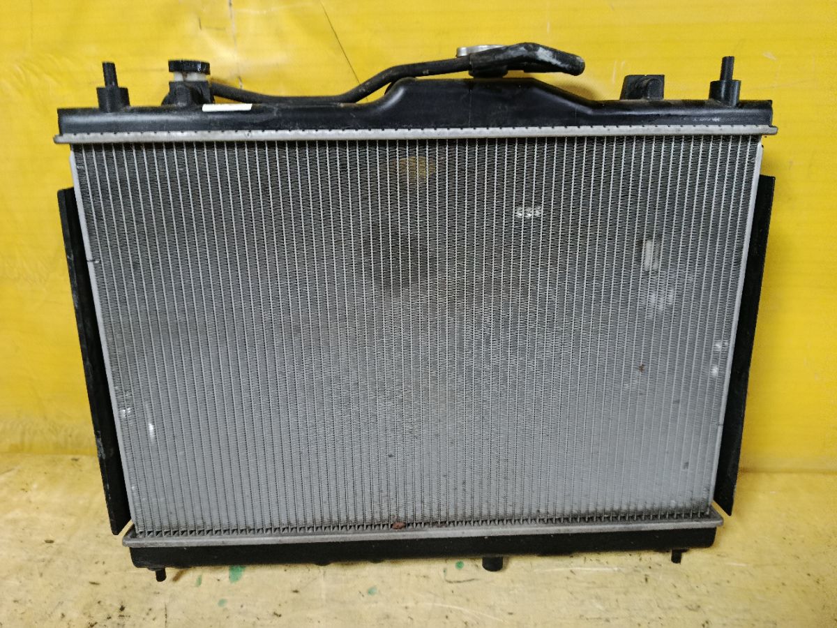 Радиатор ДВС 019M68, 070159N, 107175, 13002338, 214101FD0A, 214101FD5A, 214101JY0A, 21410EE000, 21410EW000, 271308-3, 271308-4, 2713083K, 2713083X, 272338R, 3341-8507, 37556, 58236, 60132338, 68741, 701583, CU13127, DA2803, DAP280003, DCM1878, DN2338, DRM46040, FP 50 A840-X, GD7905, LRC 141EE, N656-69, NIS010, NS0001-G11, NSY121216, PL021939, RC00322, STR0019, STR0119, TD-036-13127-16, WG1723220 на Nissan Cube Z12 HR15DE Фото 1