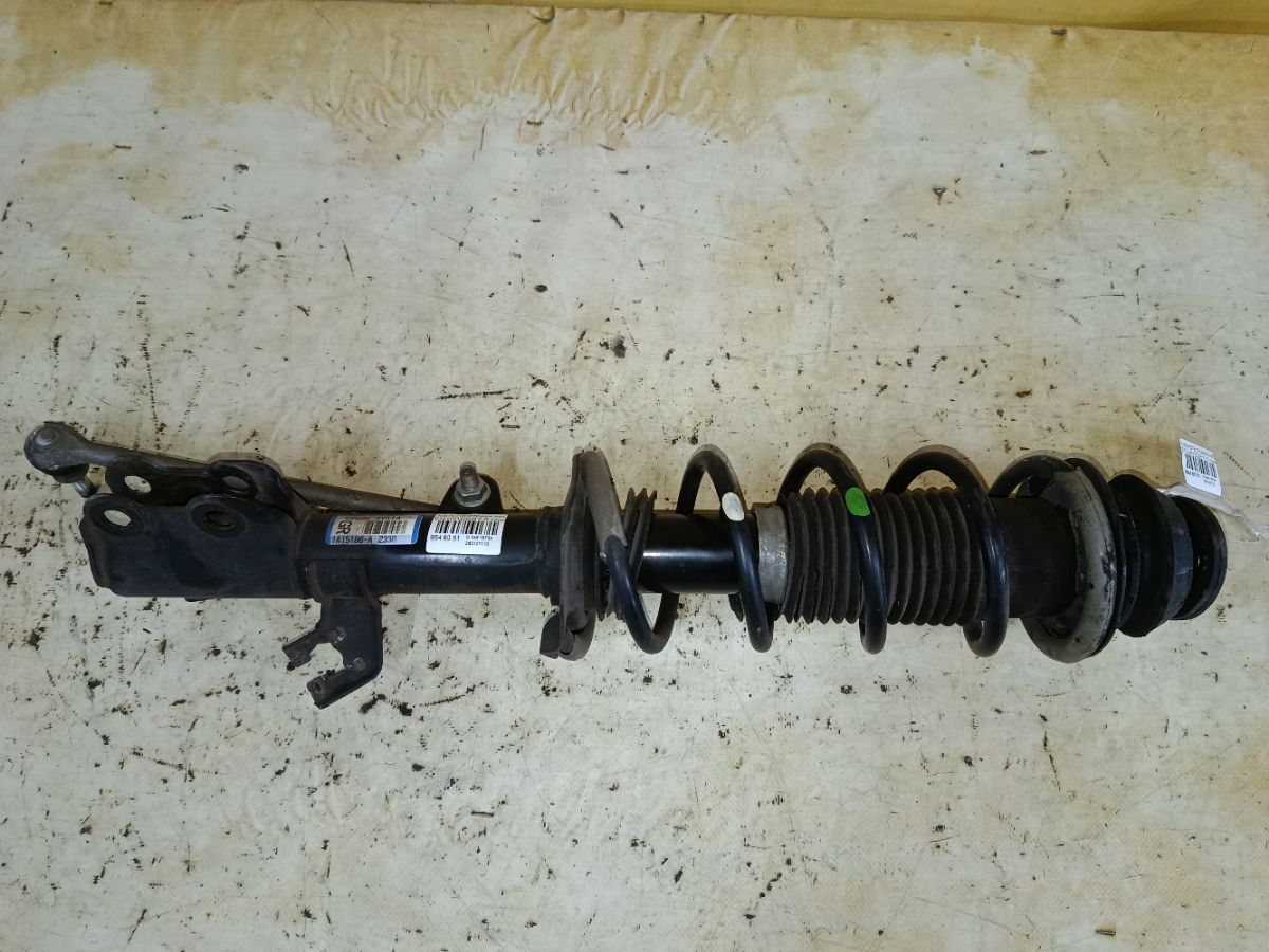 Стойка амортизатора на Nissan Note E12 HR12DDR Фото 1