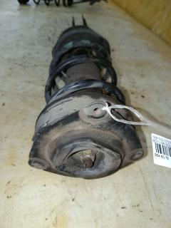 Стойка амортизатора 333391, 54303 ED025, 54303 ED50B, 54303CJ40C, 54303CJ41C, 54303ED001, 54303ED501, 54303ED50A, 54303ED525, 54303EE50B, 54303EE90A, 54303EF80A, 54303EM01A, 54303EM30C, CR-049-2726, CR-049FL-C11, E4303 EC80A, E4303 EE90A, E4303 EL00A, E4303 EM01A, E4303EM30C, SJ-049-2726, SJ-049FL-C11, ST-049-2726 на Nissan Tiida Latio SC11 HR15DE Фото 2