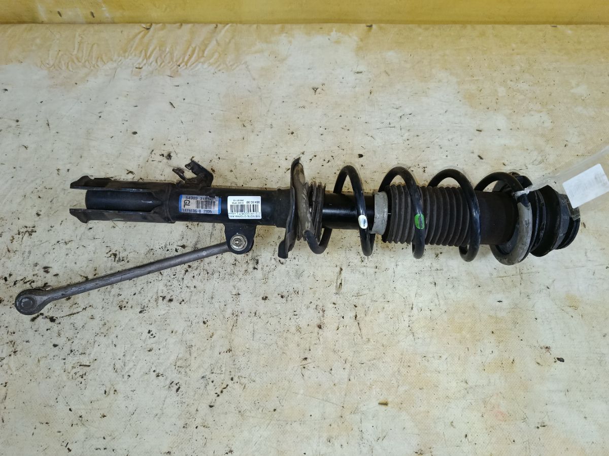 Стойка амортизатора на Nissan Note E12 HR12DDR Фото 1