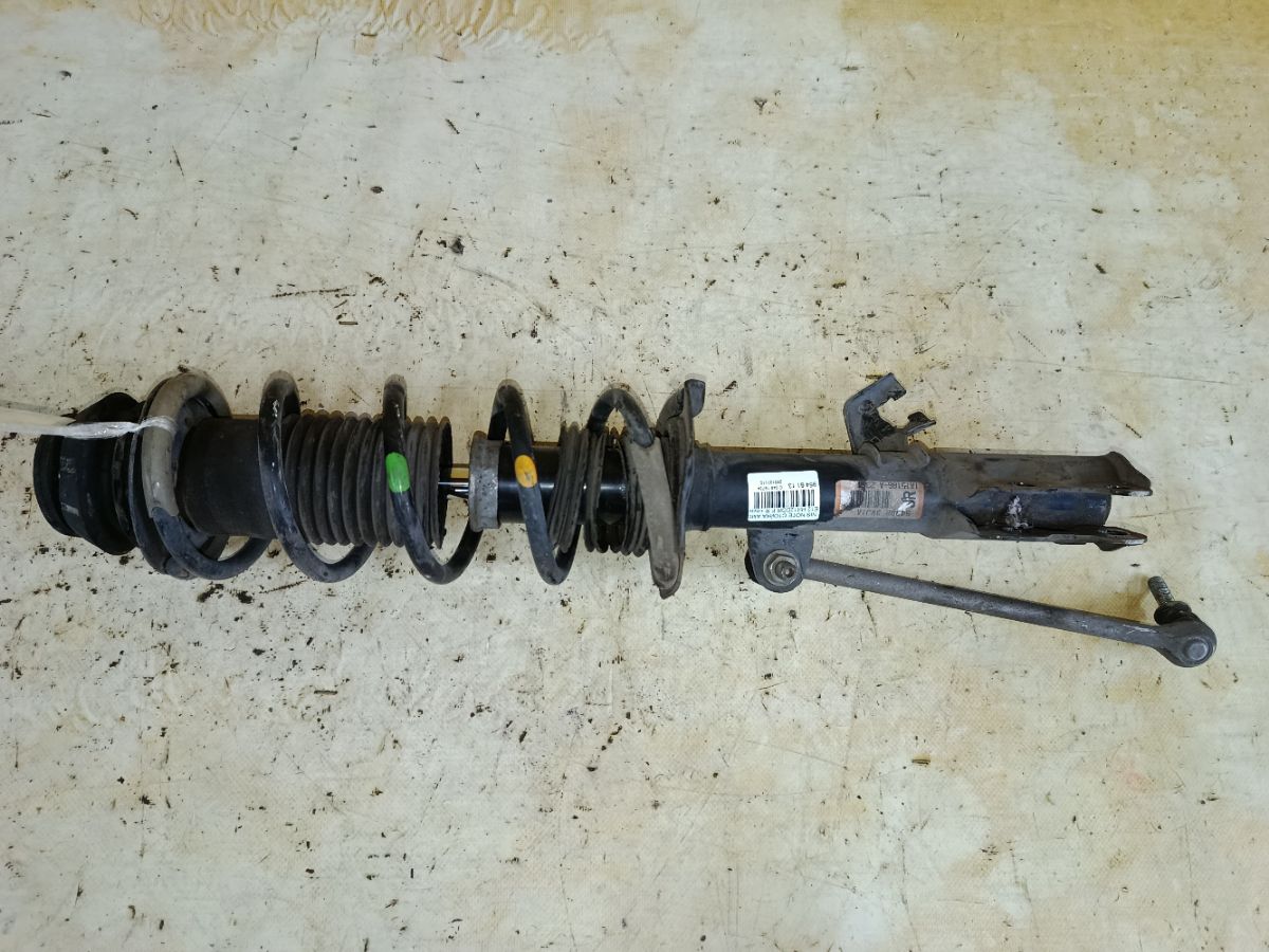 Стойка амортизатора на Nissan Note E12 HR12DDR Фото 1