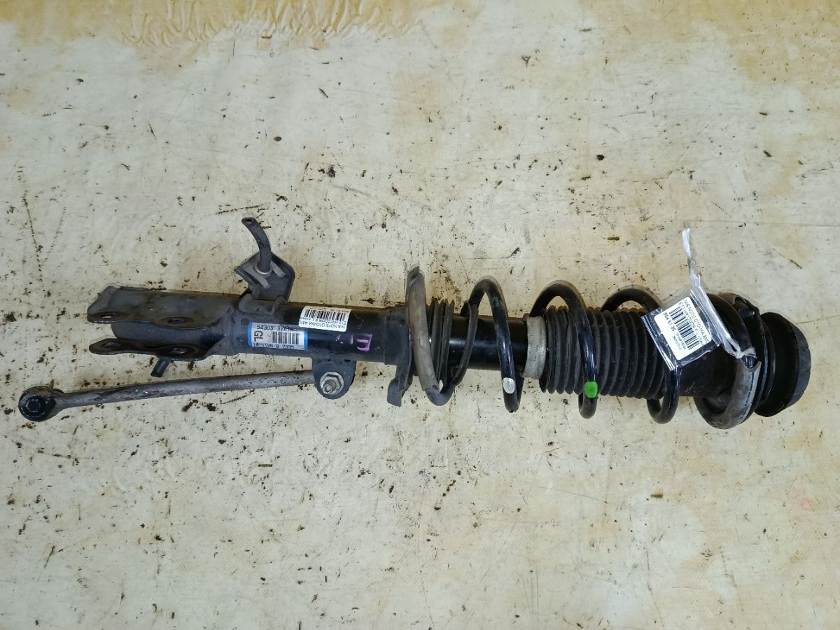 Стойка амортизатора на Nissan Note E12 HR12DDR Фото 1