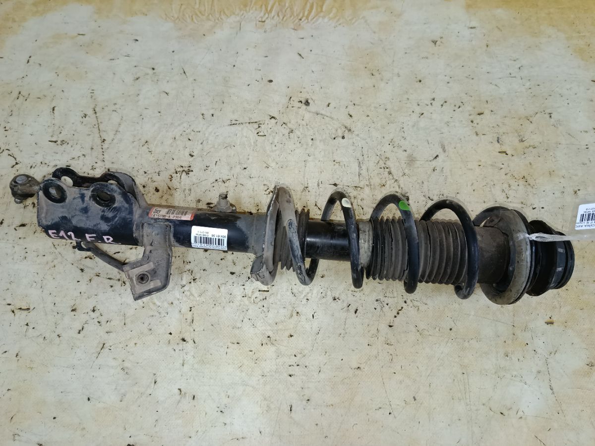 Стойка амортизатора на Nissan Note E12 HR12DDR Фото 1