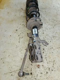 Стойка амортизатора на Nissan Note E12 HR12DDR Фото 4