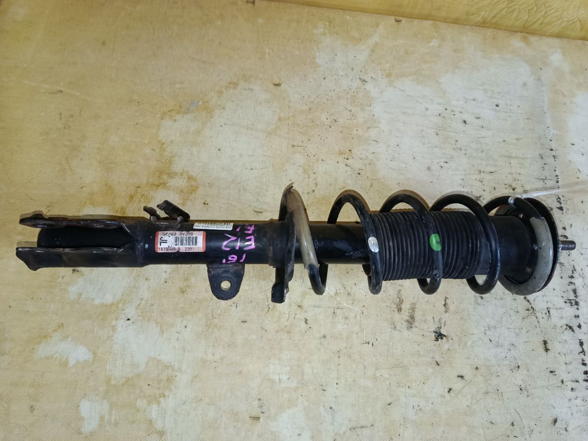 Стойка амортизатора на Nissan Note E12 HR12DDR Фото 1