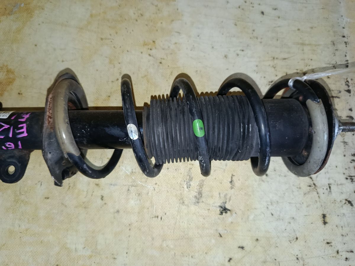 Стойка амортизатора на Nissan Note E12 HR12DDR Фото 3